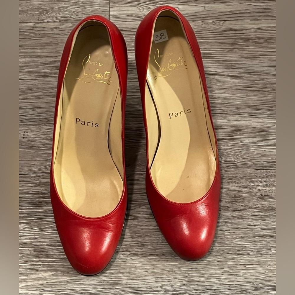 Christian Louboutin red pumps